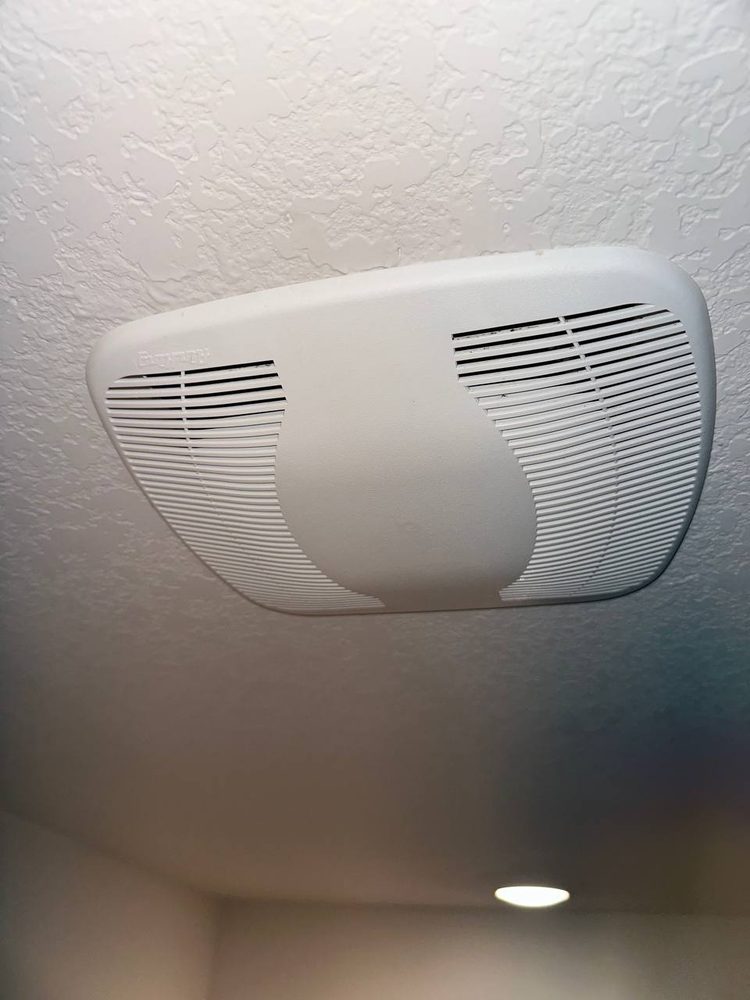 New bathroom exhaust fan installed in the ceiling