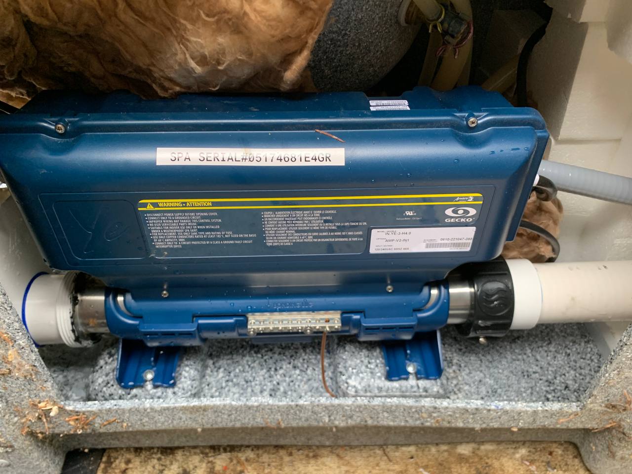 Gecko spa control pack and heater assembly mounted inside a hot tub cabinet