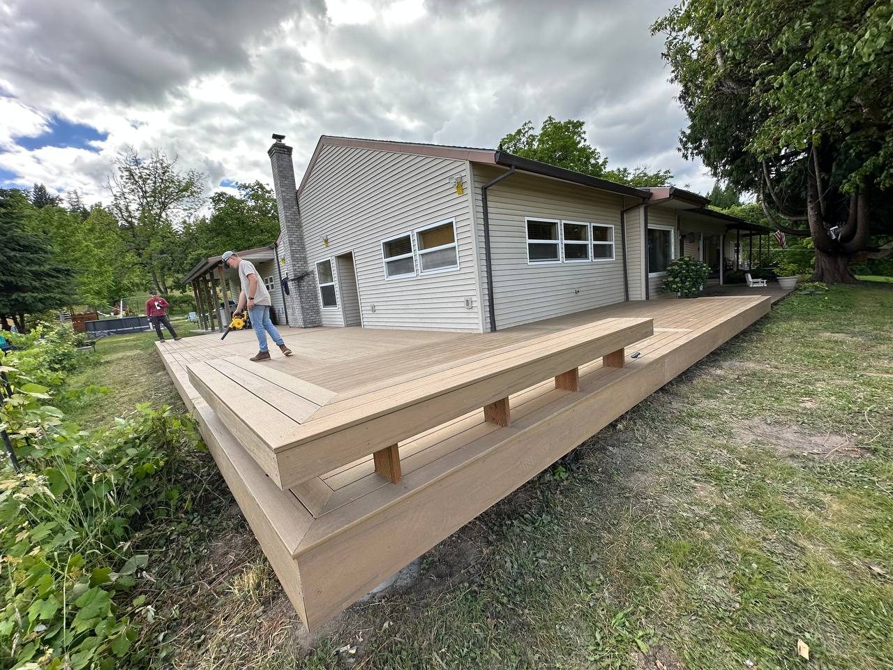 Finished composite deck and steps built off the back of a home